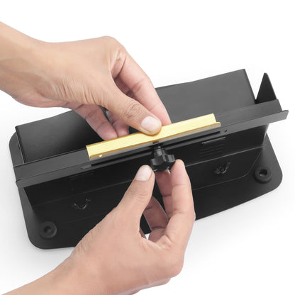 Hands using Labelji manual label applicator to place a label - easy to use labeling tool for bottles and jars